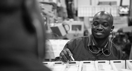 Worker inspecting cigarettes