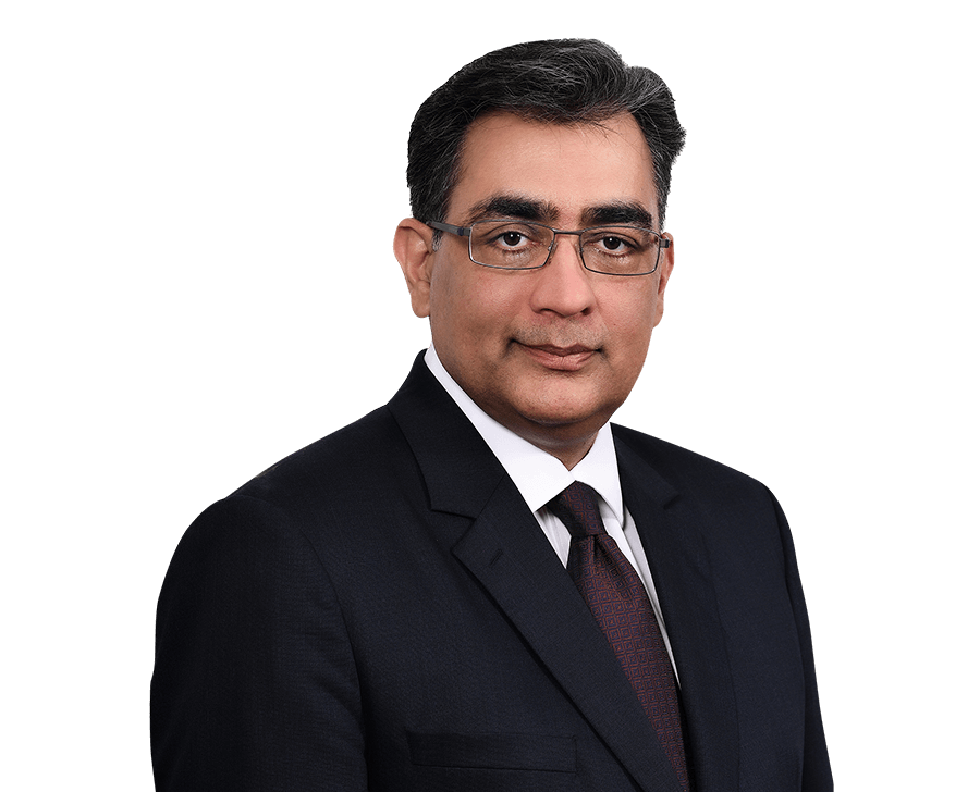 a man wearing glasses and a suit