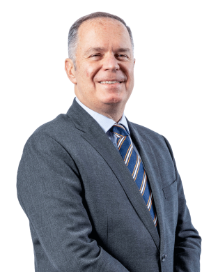 Fred wearing a suit smiling for the camera